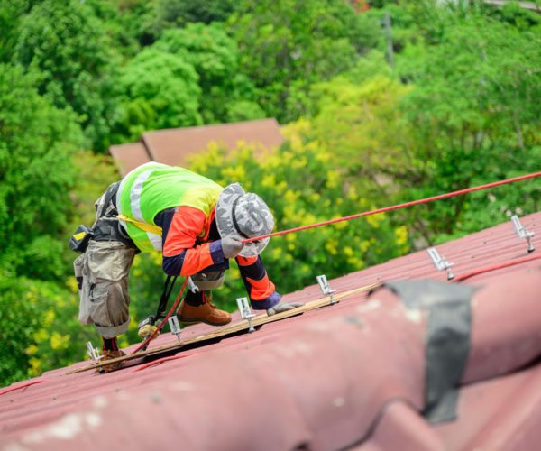 Professional engineer worker installing solar panels system on rooftop, Clean energy sources, Concept of alternative and renewable energy, Environment and technology concept