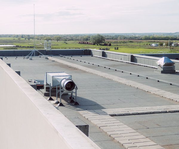 walkable terrace on the roof of the industrial hall is coated with a waterproofing material to protect the building from moisture damage.